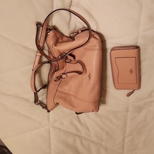 Gently used beautiful Pink coach purse and wallet.